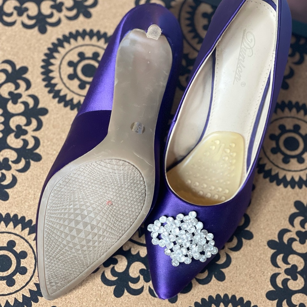 Purple heels with diamond brooch